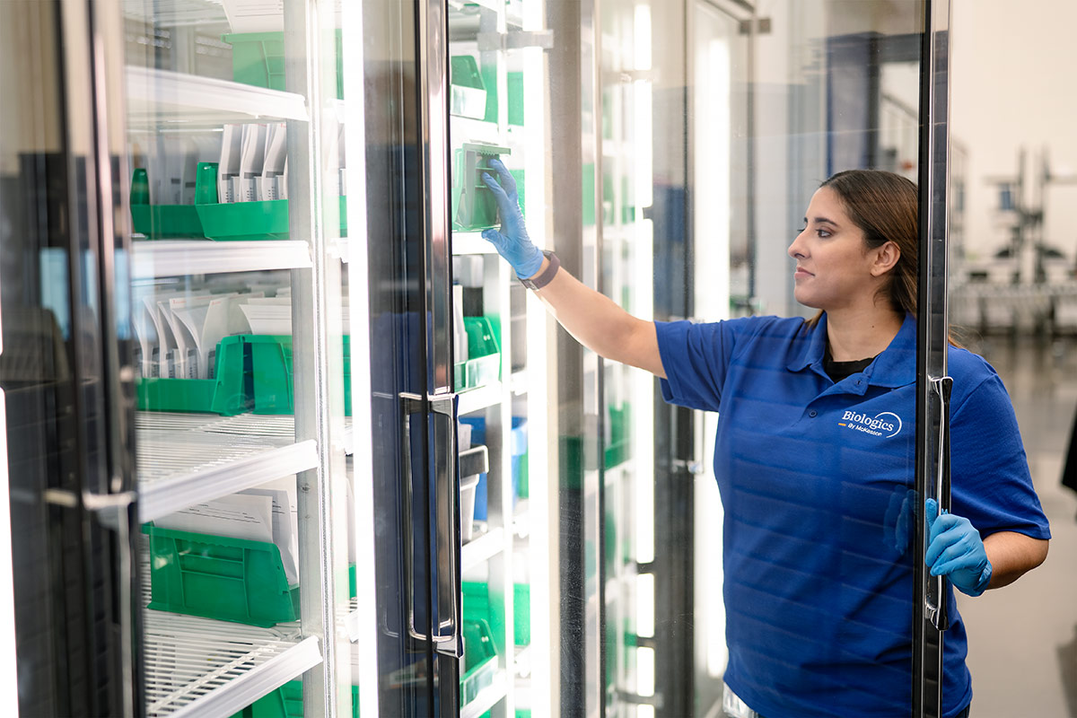 woman opening door to medication storage area