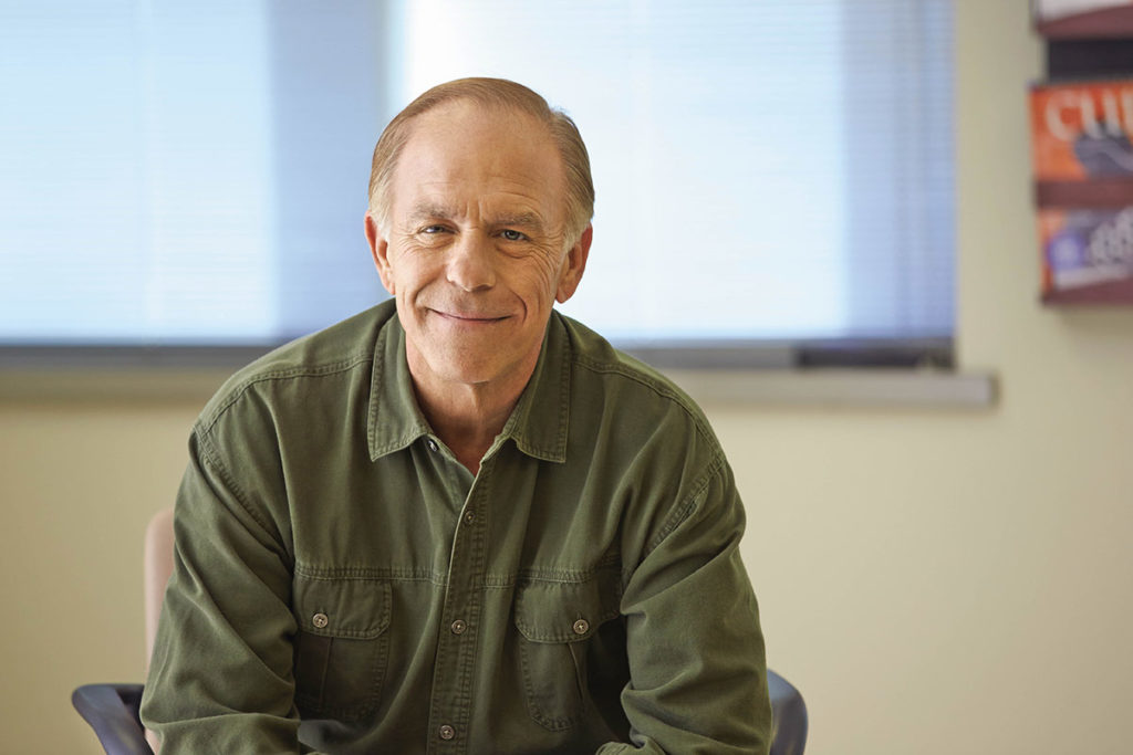 man looking at camera smiling