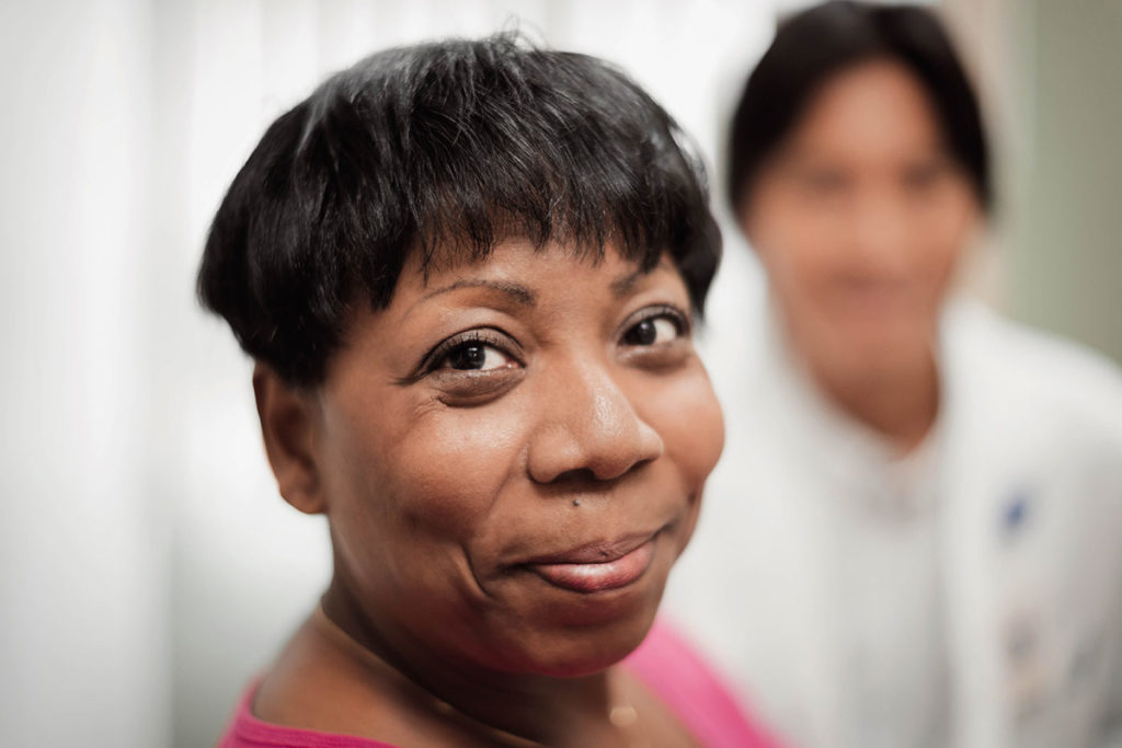 female patient smiling at camera