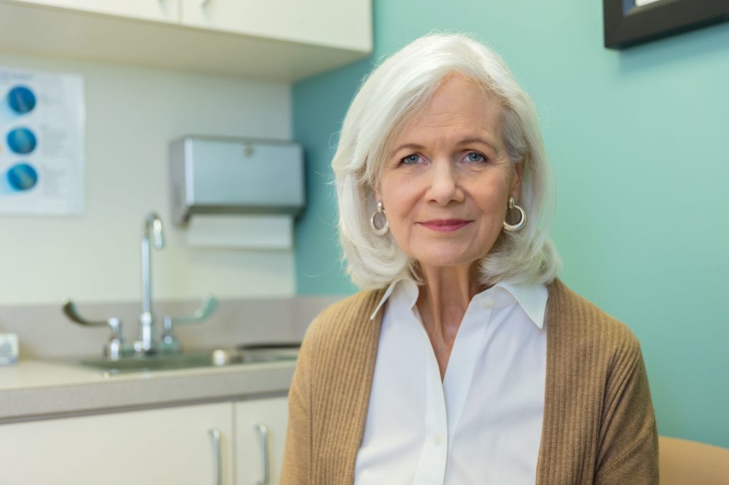 A female health provider in a doctor's office