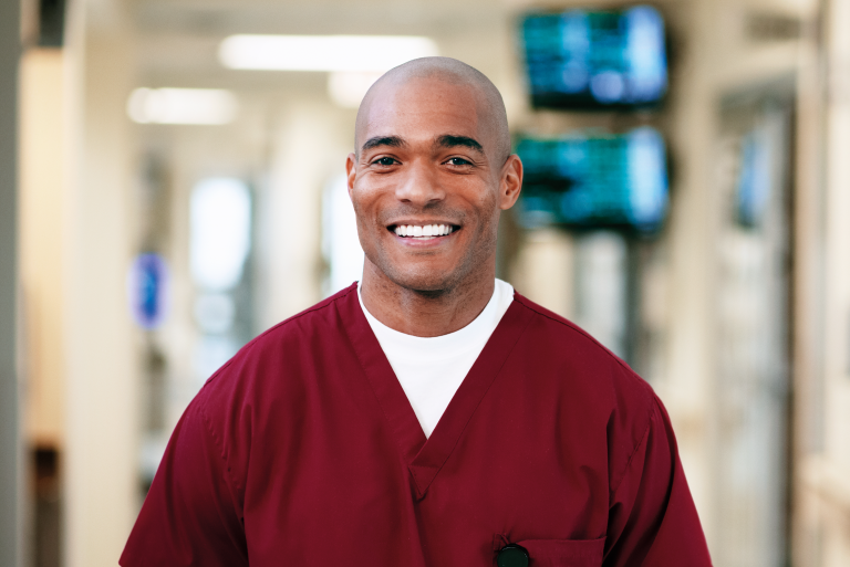 A male nurse in a hospital hallway